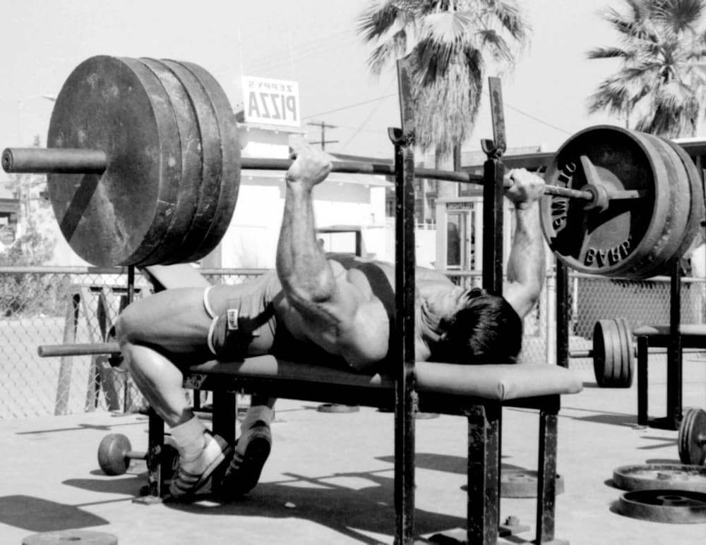 man lifting weights